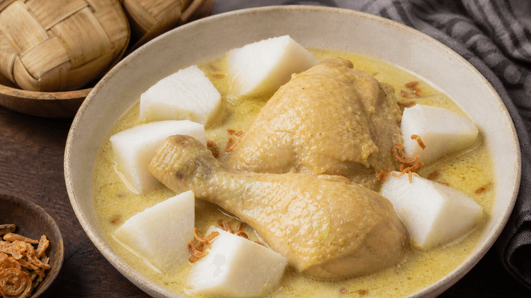 Opor Ayam method step 5, Serve with rice cake: Soft chicken with gentle coconut richness.