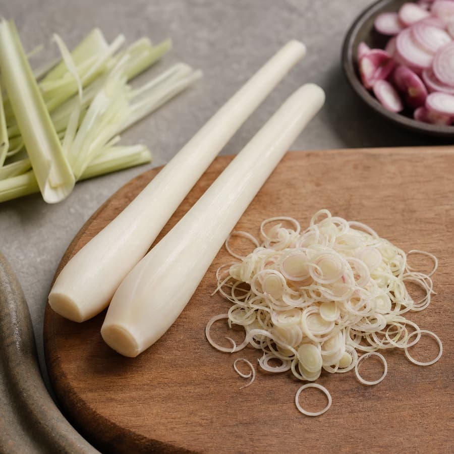 tender white lemongrass hearts (bagian putih serai yang muda) for Crispy-Skin Salmon Sambal Matah
