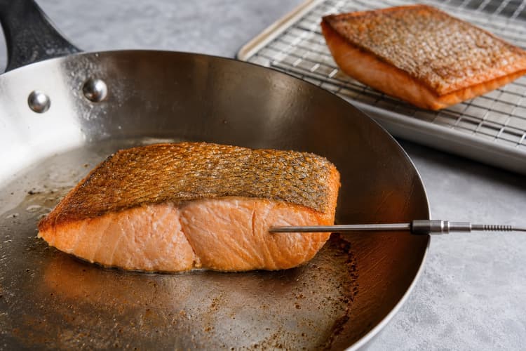 Crisp-Skin Salmon with Miso-Lemon Butter method step 5, Kiss the flesh side to exact doneness: The centre reaches 63°C, flakes moist and opaque, releases little albumin, and skin stays crisp.