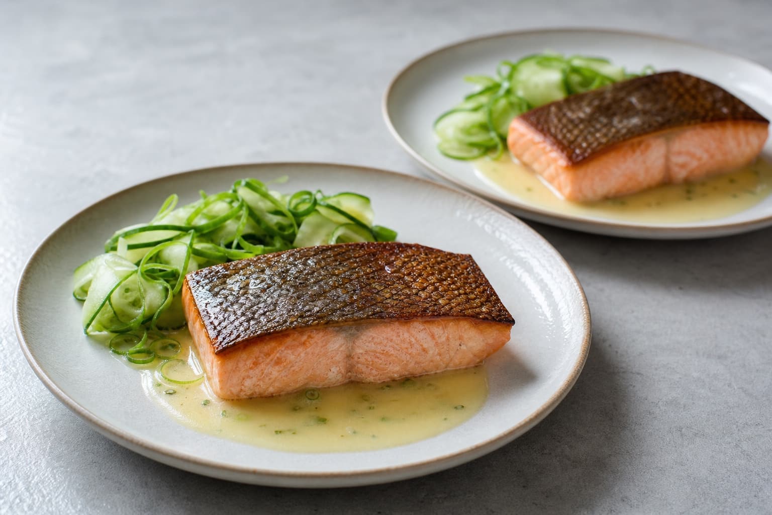 Crisp-Skin Salmon with Miso-Lemon Butter, step 6, Plate without softening the skin: Sauce has no oily ring, cucumber has no puddle, and every millimetre of skin remains above wet components.