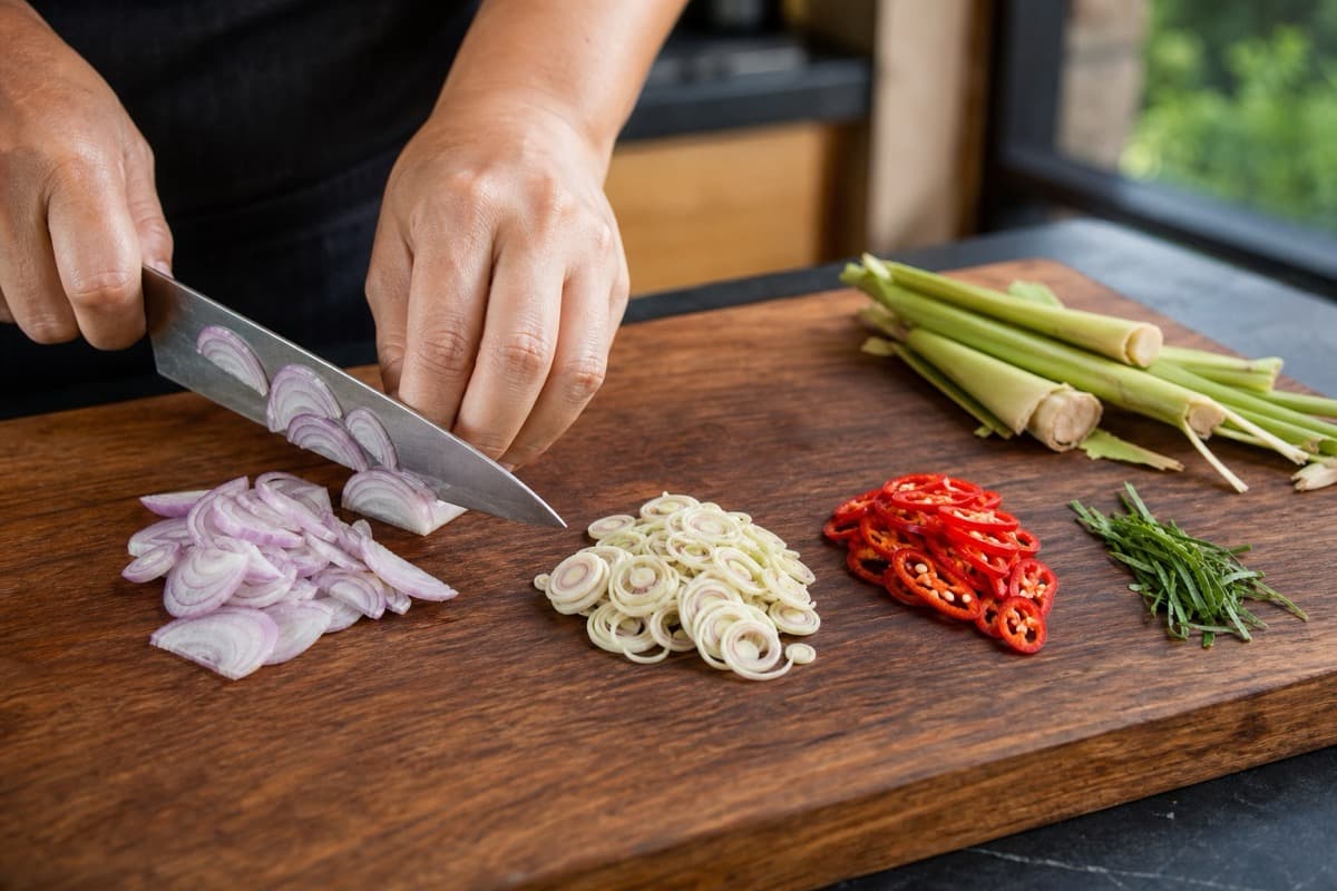 Crispy-Skin Salmon Sambal Matah, step 2, Slice the sambal aromatics finely: Every aromatic is recognisable, fine enough to chew raw, and the lemongrass is white rather than green.