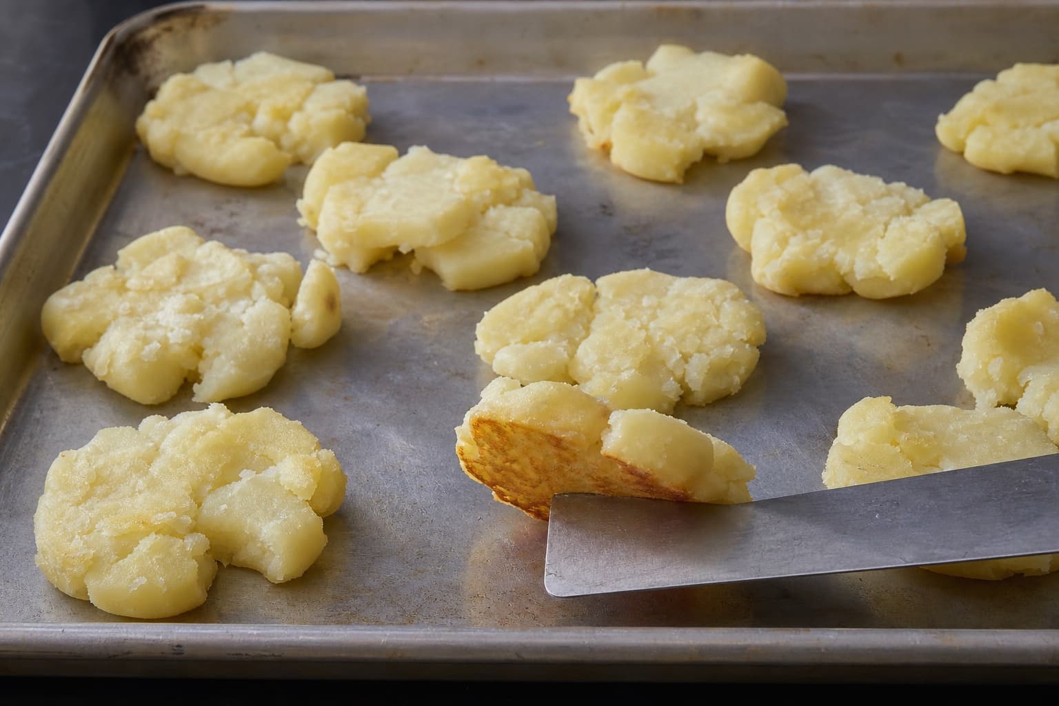 Ultra-Crispy Smashed Potatoes, step 4, Set the first crust untouched: The underside is rigid, light golden, and releases as one crust.